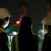 Construction workers at nighttime jobsite